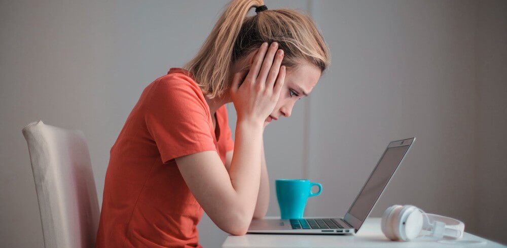 Frustrated woman viewing a poor website